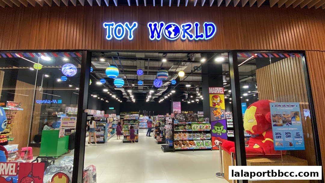 The entrance of Toy World, a brightly lit toy store with colorful displays and Marvel characters.