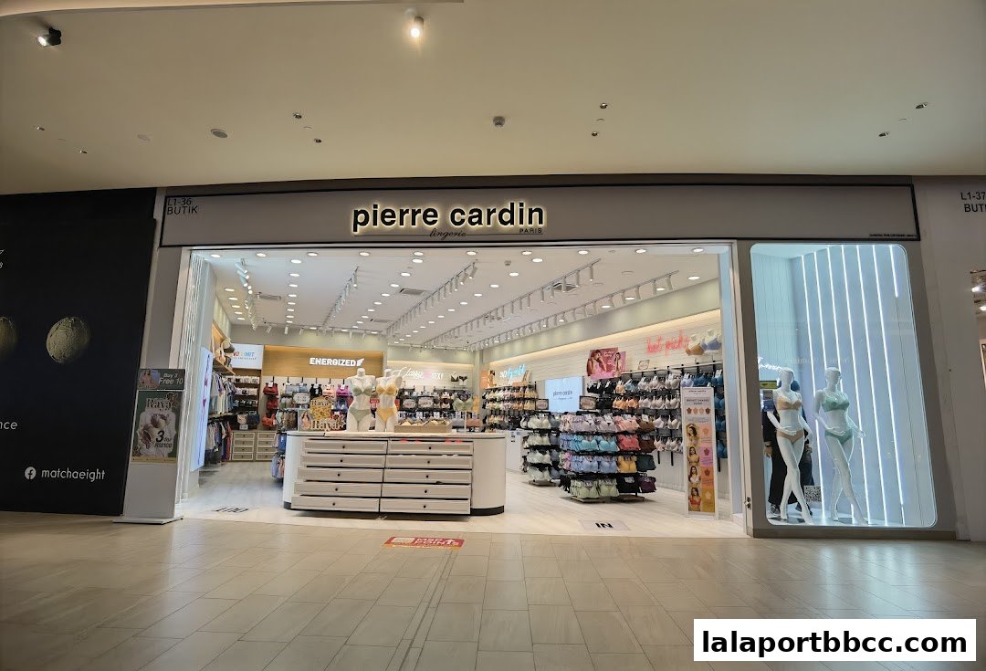 The Pierre Cardin Lingerie shop front displays mannequins and a wide selection of lingerie.
