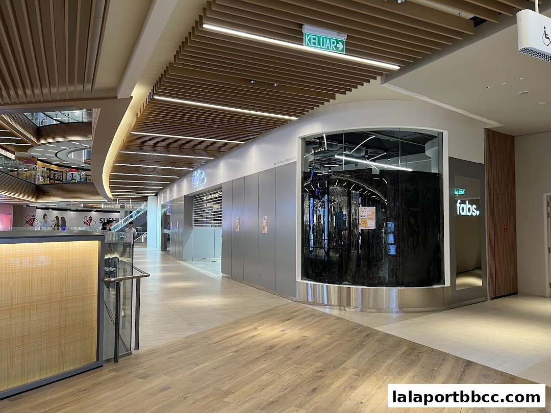 The modern storefront of Fabs at Lalaport, featuring a sleek design and illuminated signage.