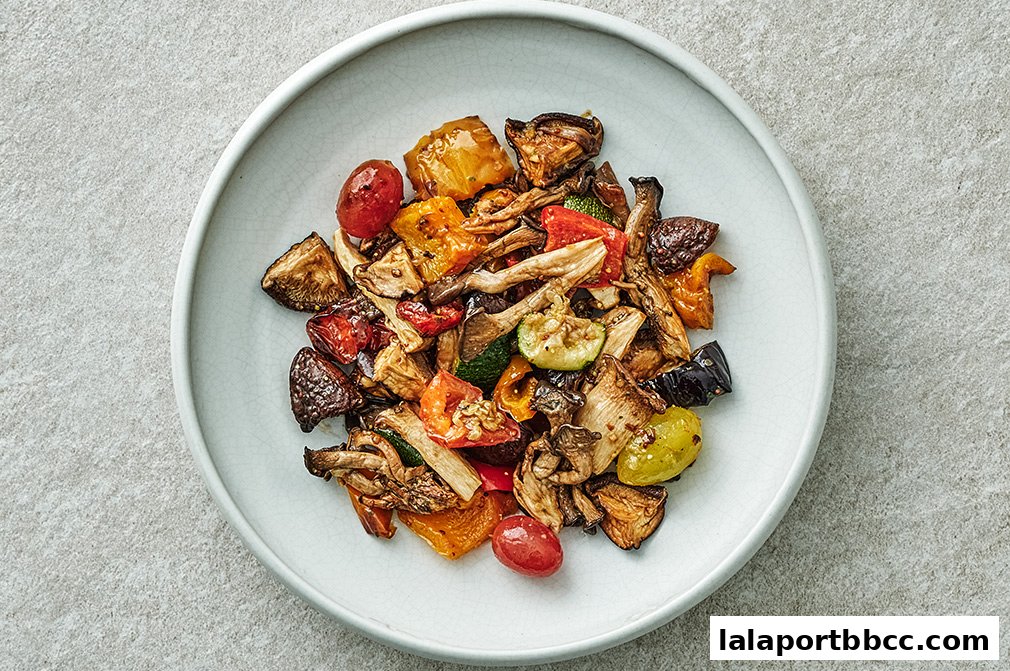 A close-up overhead view of a plate filled with roasted mixed vegetables.