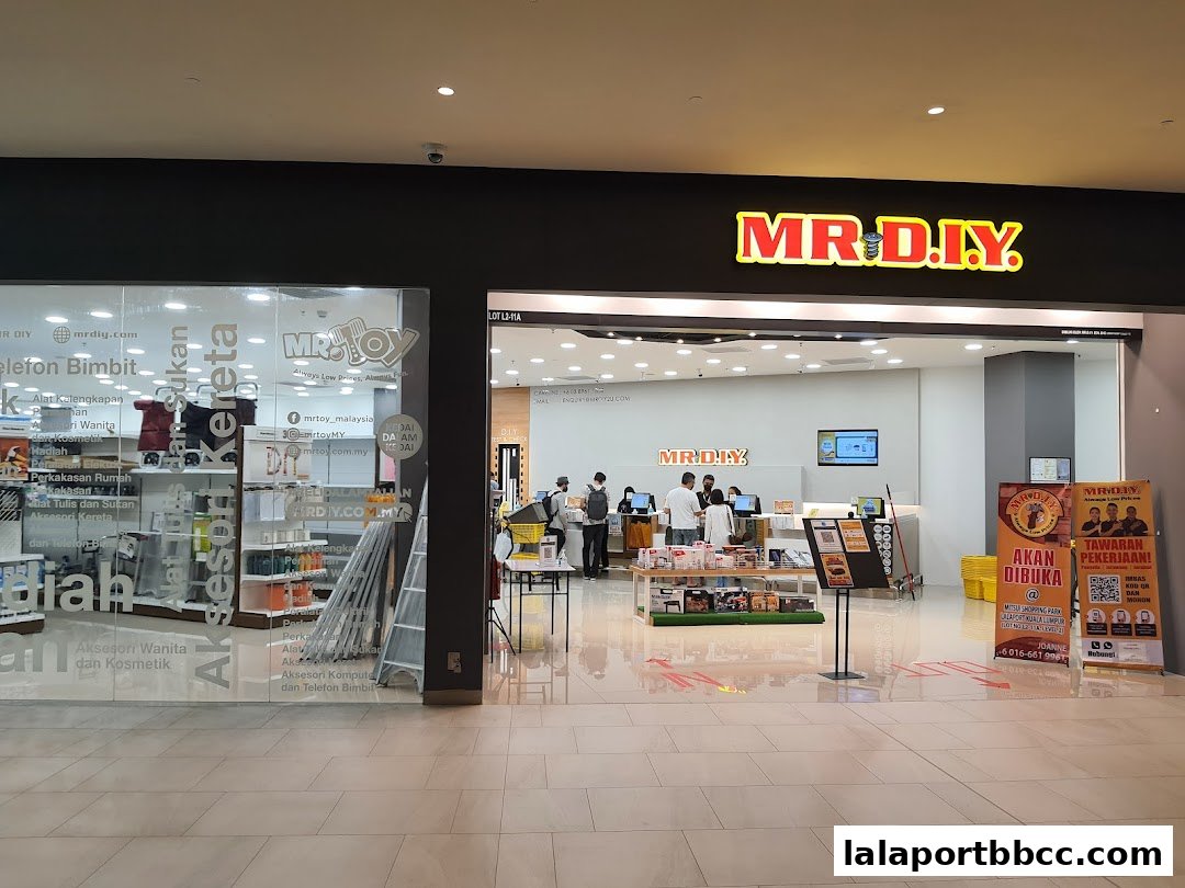 The entrance to MR. D.I.Y. and MR. TOY stores in a shopping mall, with displays and staff visible.