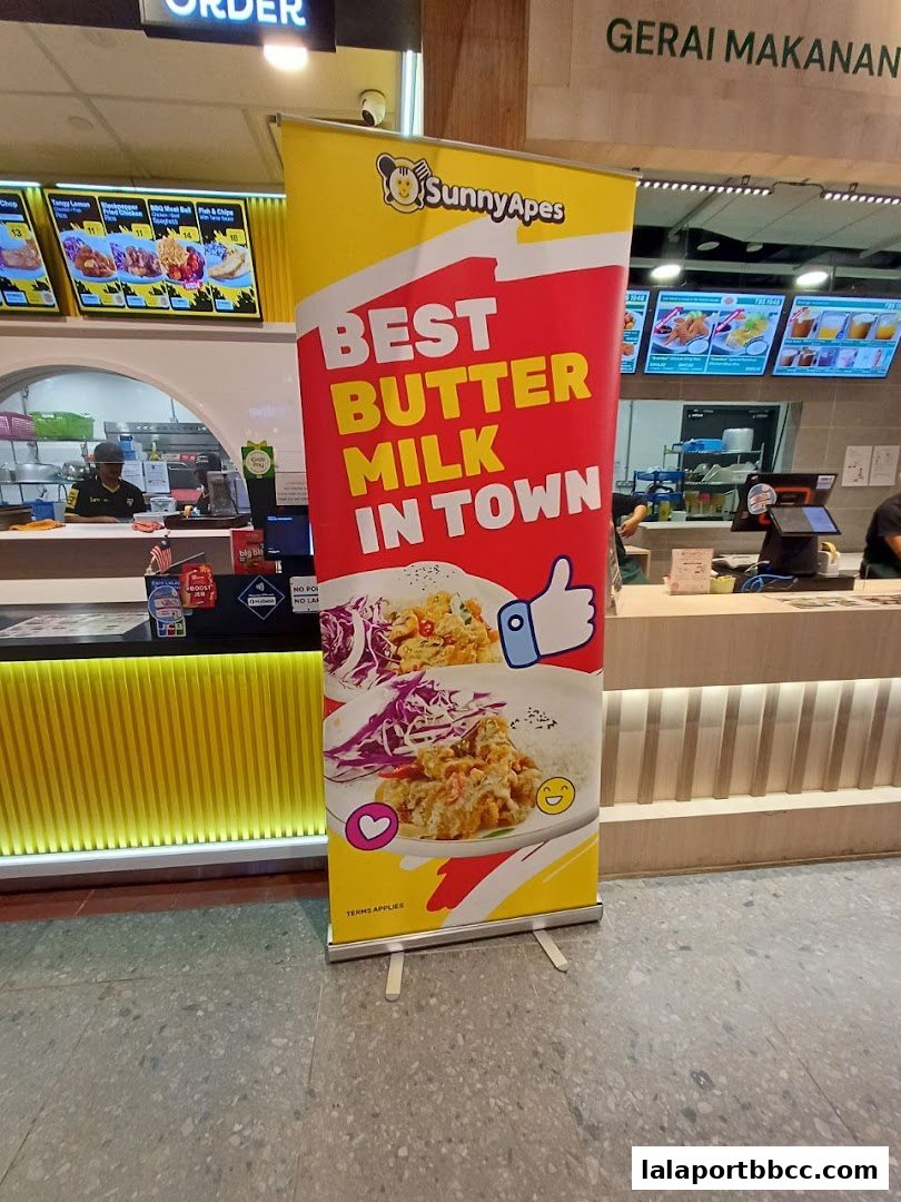 A banner advertising Sunny Apes' "Best Butter Milk in Town" with images of food.