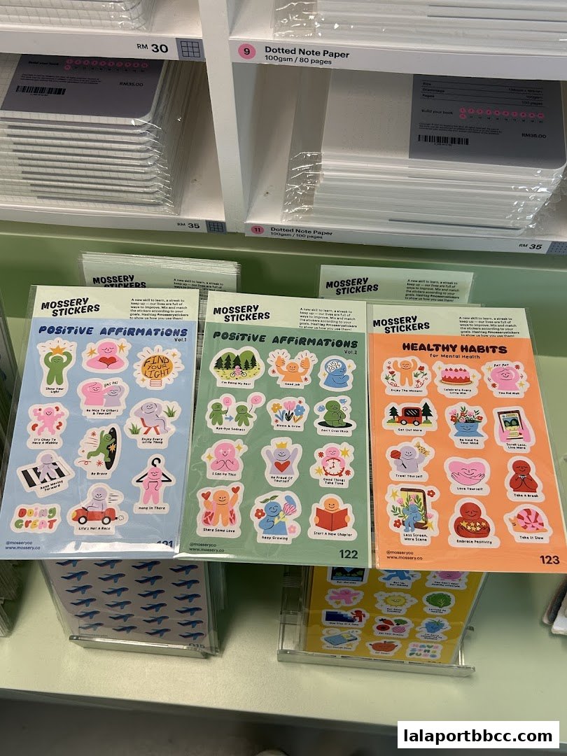 Stickers with positive affirmations and healthy habits displayed in a shop.