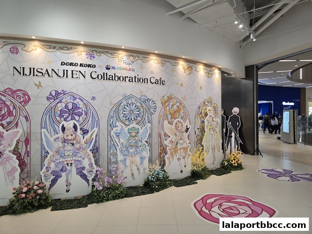Doko Koko x NijiSanji EN Collaboration Cafe with anime character cutouts and floral decor.