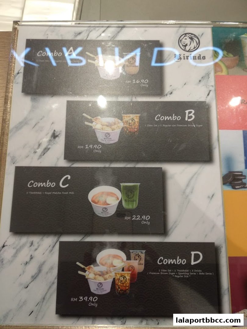 A menu board displaying various combo meals with food and drinks from Kirindo.