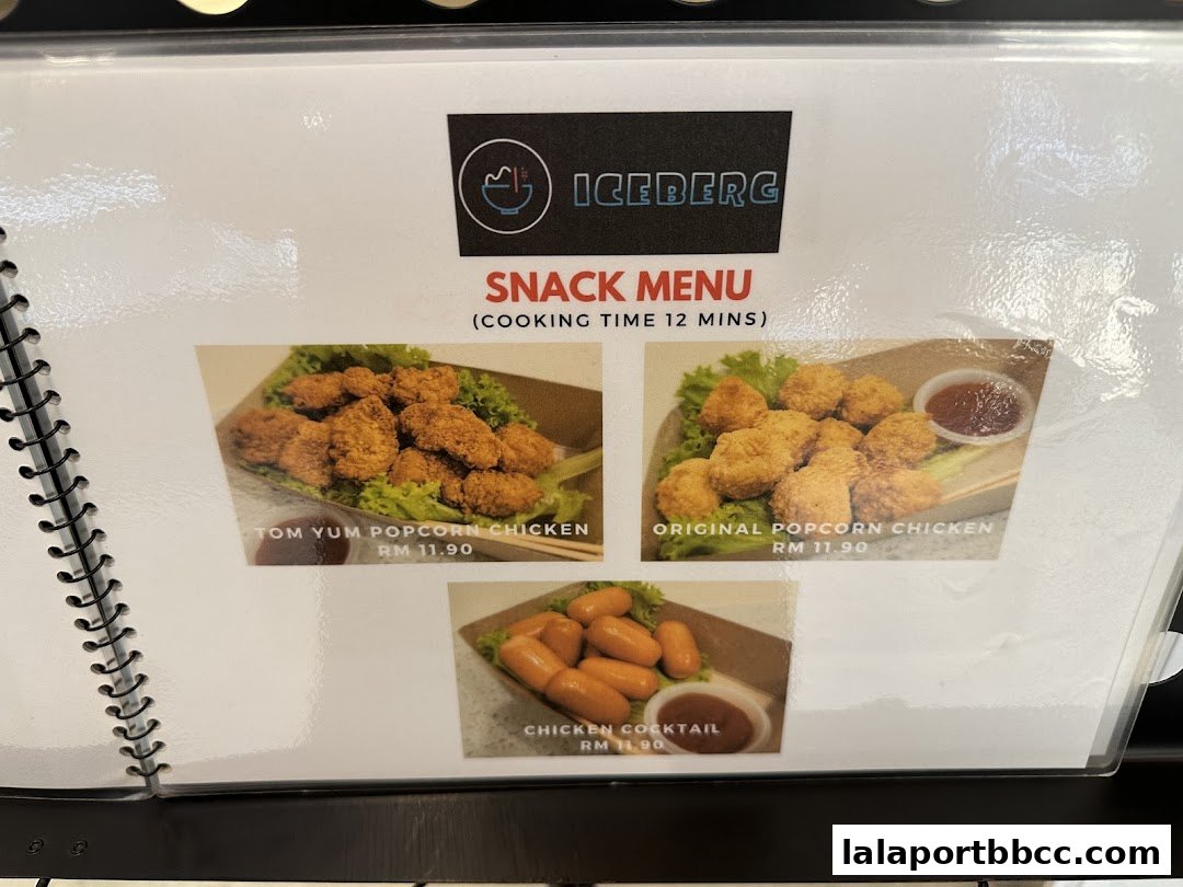 A menu from Iceberg LaLaport featuring popcorn chicken and cocktail sausages.