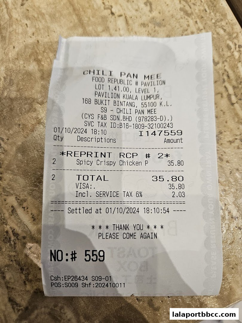 A receipt from Chili Pan Mee showing a purchase of Spicy Crispy Chicken.