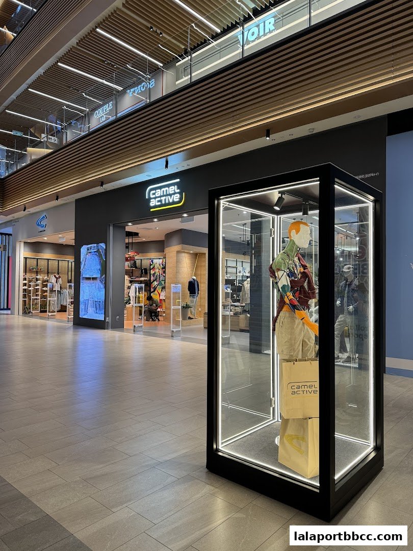 Camel Active store entrance with a mannequin display in a glass case.