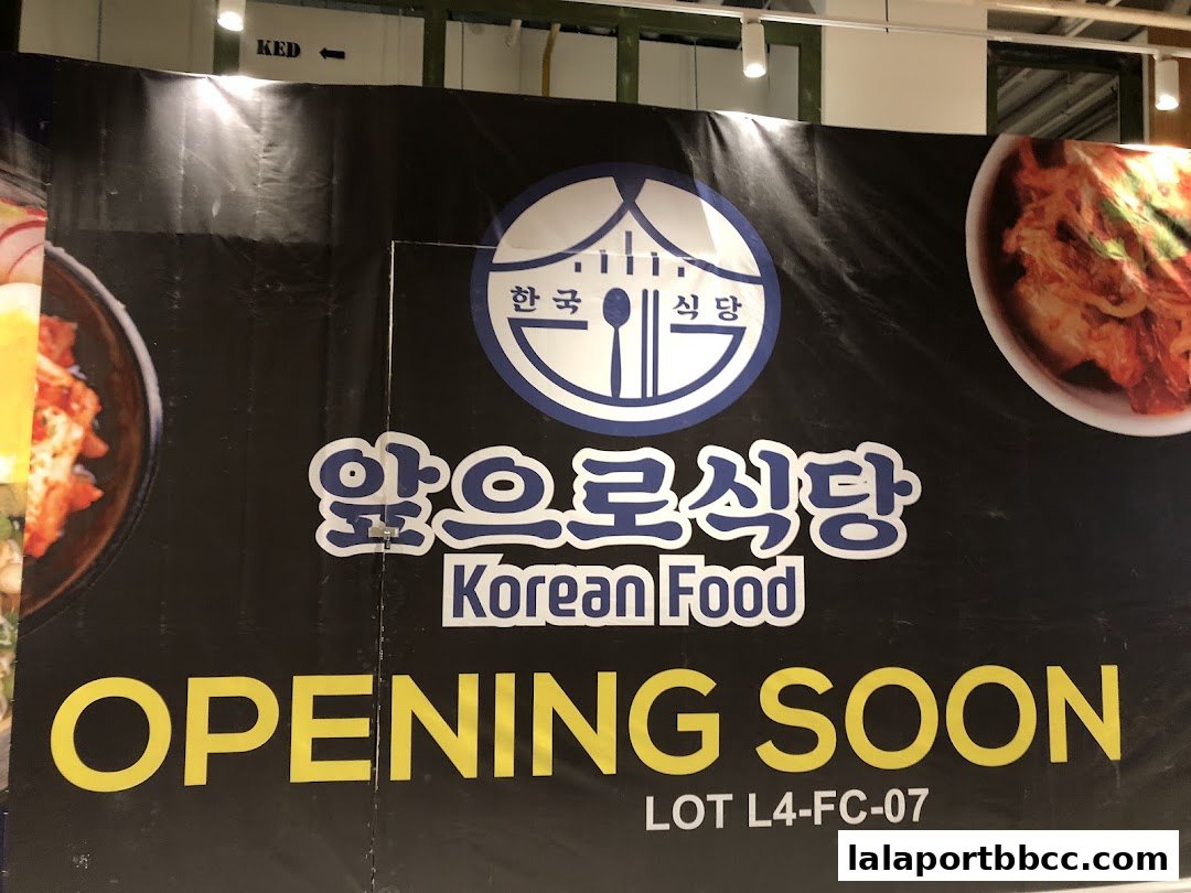 A banner announcing the upcoming opening of a Korean food restaurant.