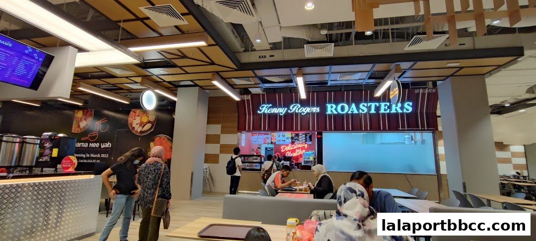 Interior view of a food court with Kenny Rogers Roasters and other food stalls.