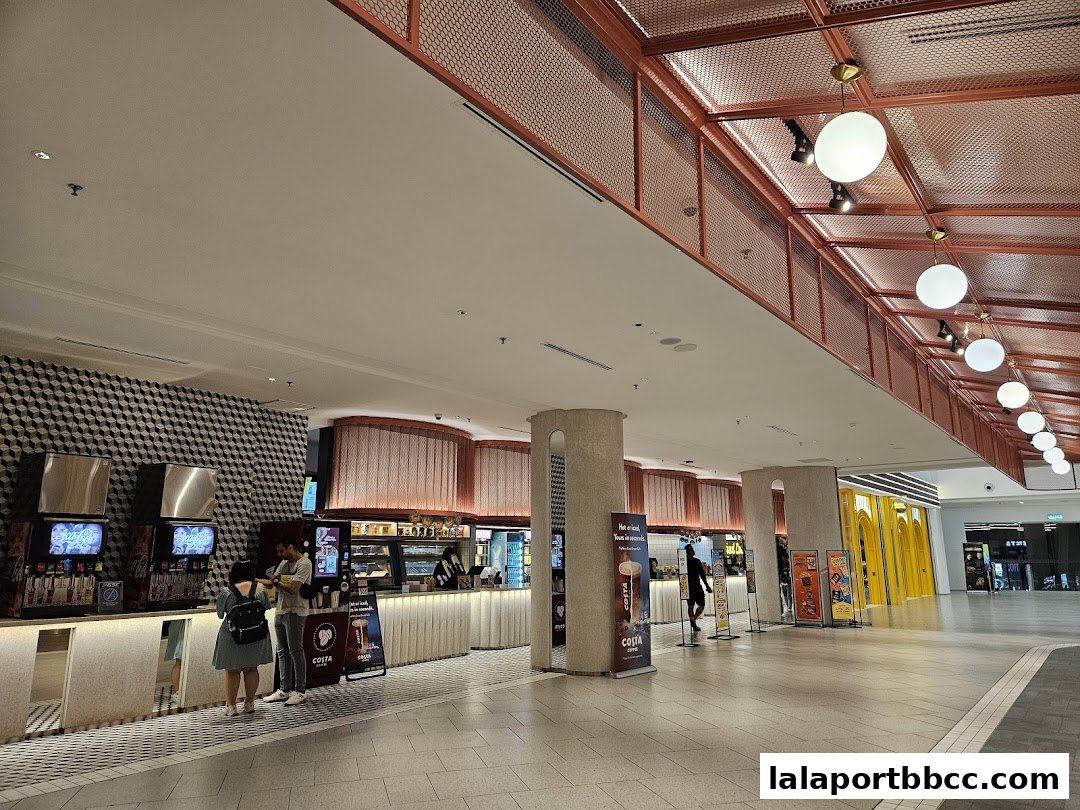 Interior view of a Costa Coffee shop with customers ordering at the counter.