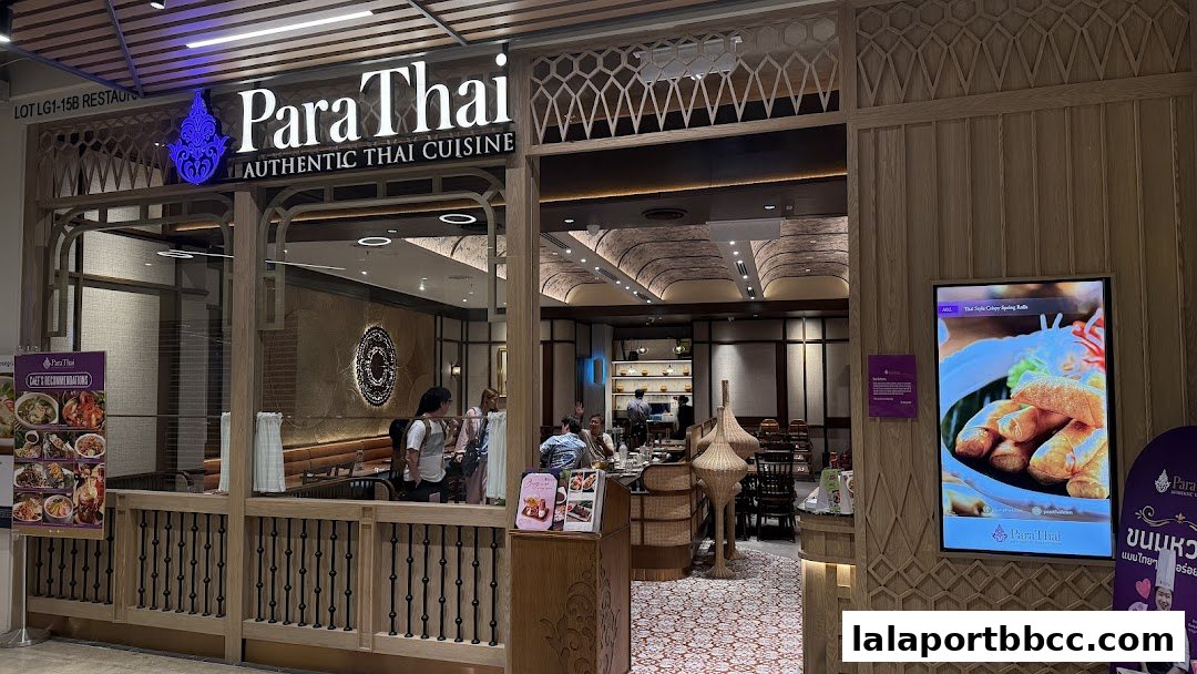 The entrance of ParaThai, an authentic Thai cuisine restaurant, with a digital menu and chef's recommendations displayed.