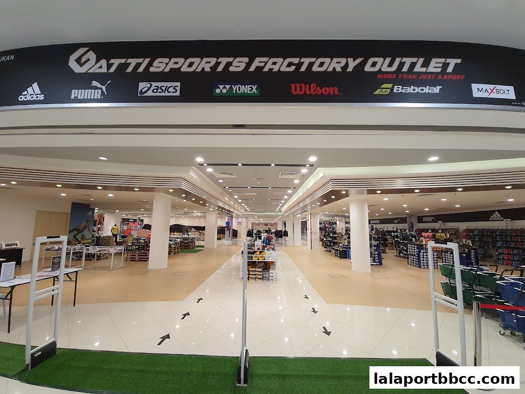 The entrance to Gatti Sports Factory Outlet, showcasing various sports brands and merchandise.