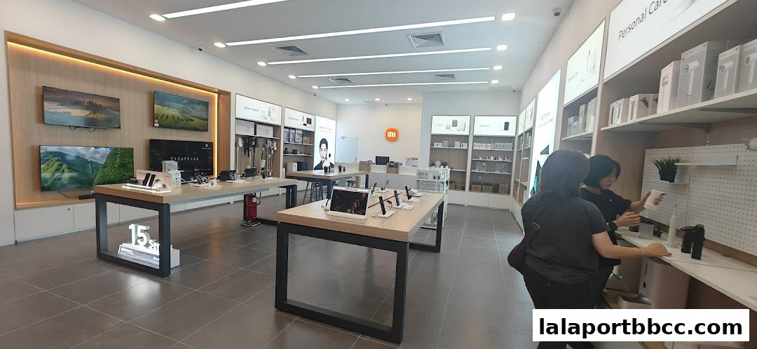 Interior view of a modern Xiaomi store showcasing various electronic products and displays.
