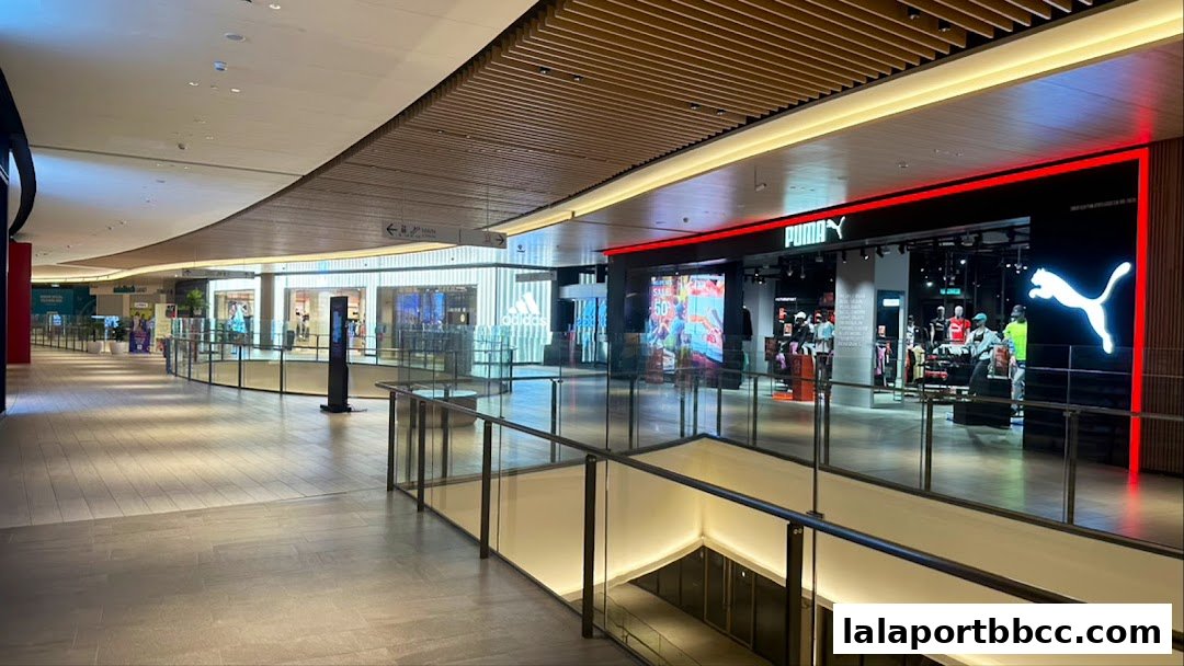 The PUMA store entrance with its iconic logo and display of merchandise.
