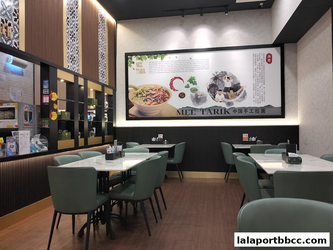 Interior view of Mee Hiris China Muslim restaurant with tables and chairs.