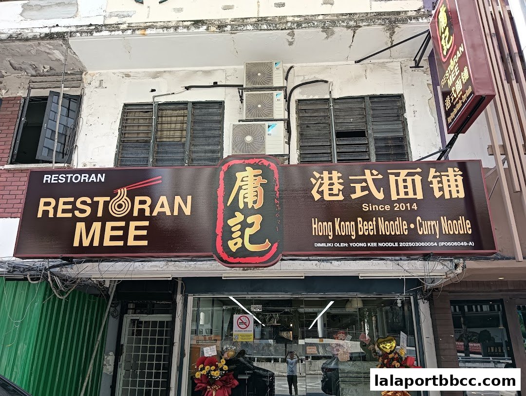 The exterior of a Hong Kong-style noodle shop with a prominent sign.