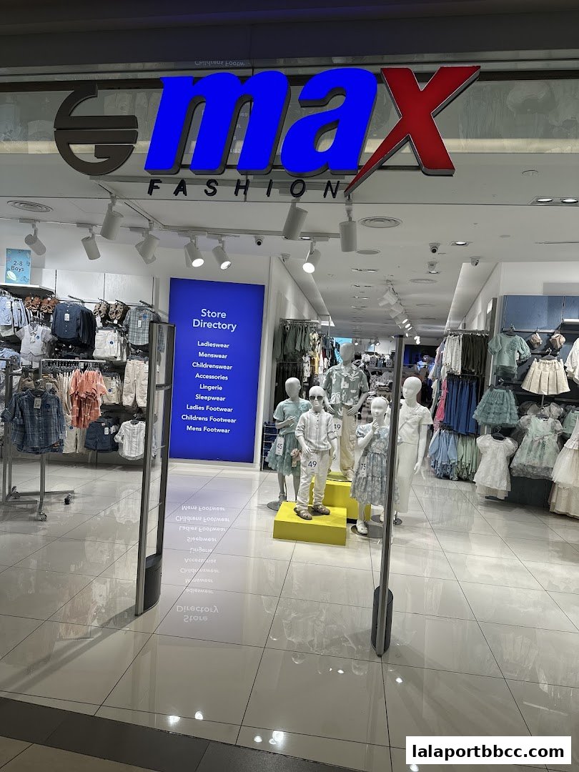 The entrance of a Max Fashion store showcasing clothing displays and mannequins.