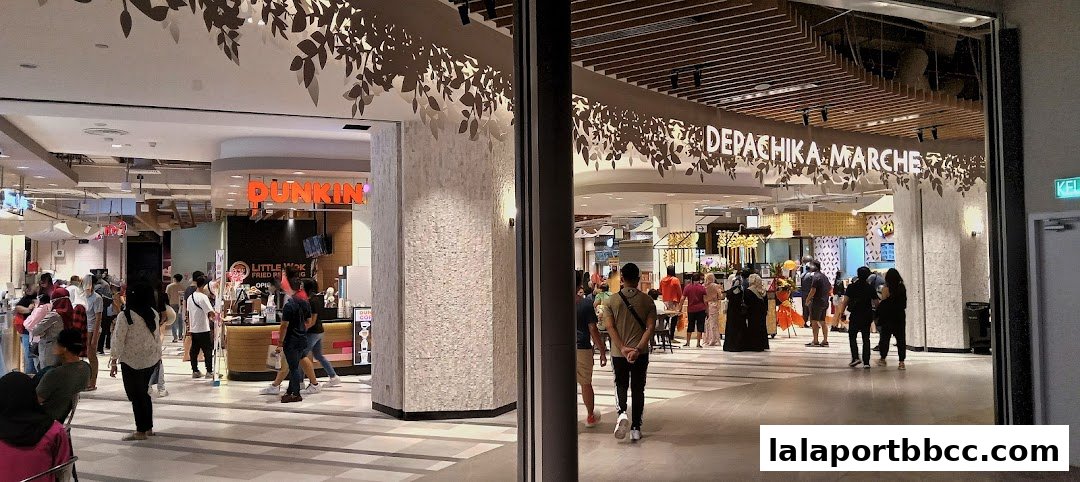 A bustling food hall with various eateries and shoppers, featuring the 'Depachika Marche' sign.