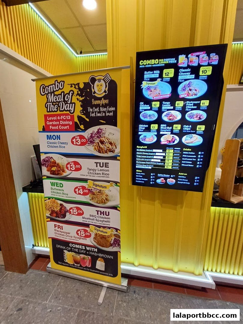 A digital menu board and a promotional banner for Sunny Apes restaurant.