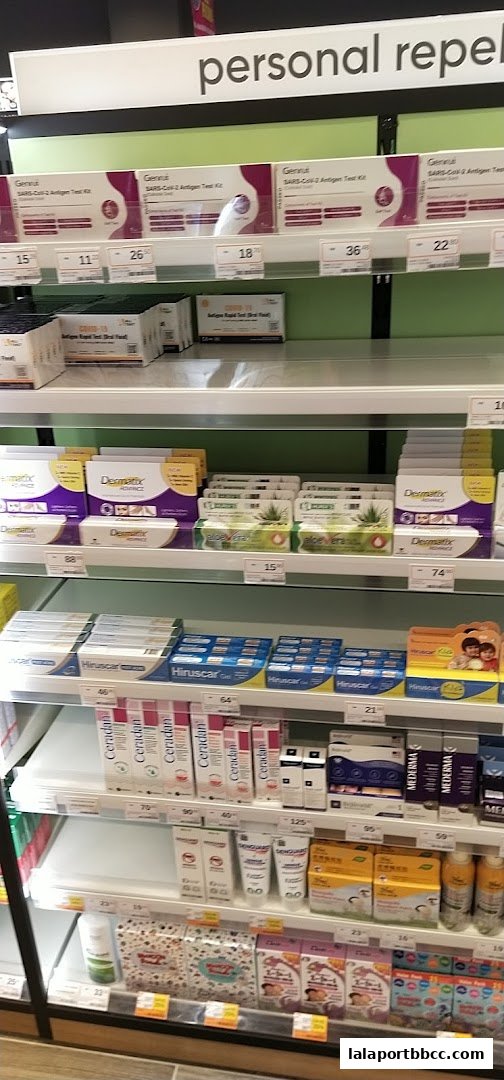Shelves stocked with personal care products, including COVID-19 test kits and skincare items.