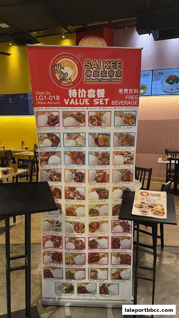 A promotional banner for Sai Kee Restaurant showcasing value set meals with free beverages.