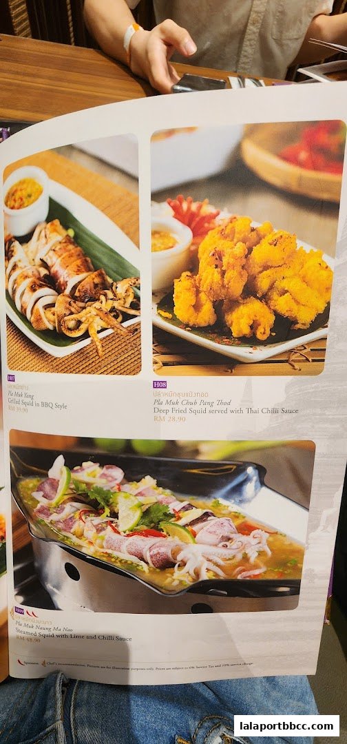 A menu page showcasing three different squid dishes with descriptions and prices.