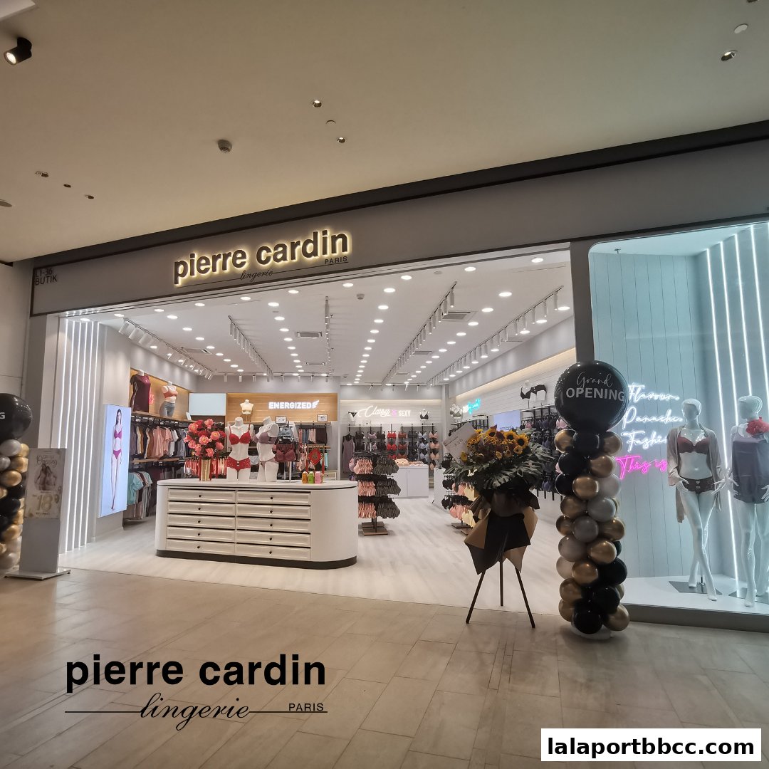 The exterior of a Pierre Cardin Lingerie store with a grand opening display.