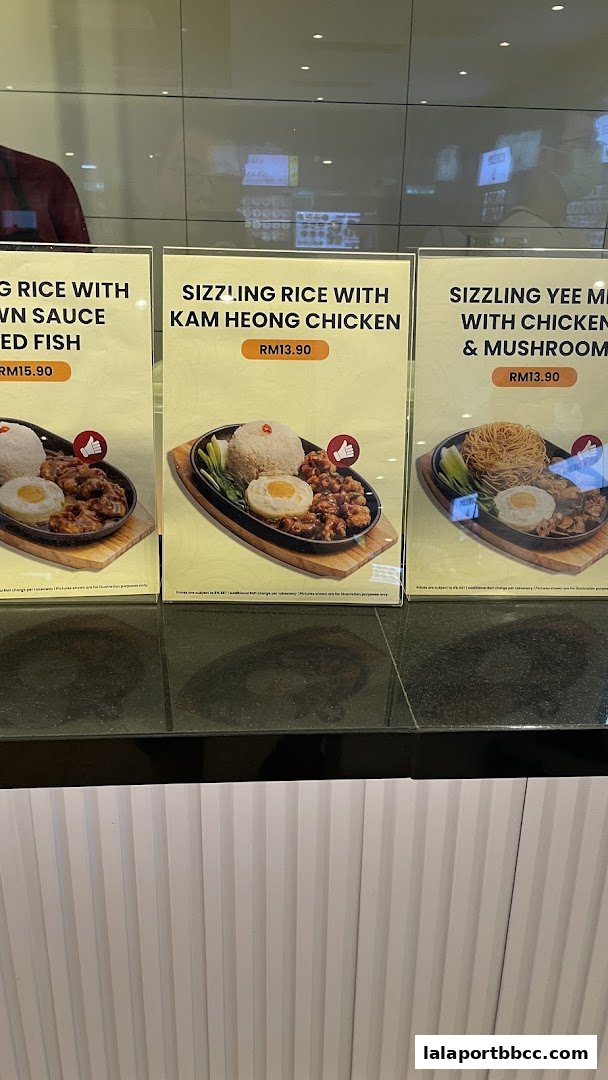 Three sizzling claypot dishes with rice and chicken, priced in RM.
