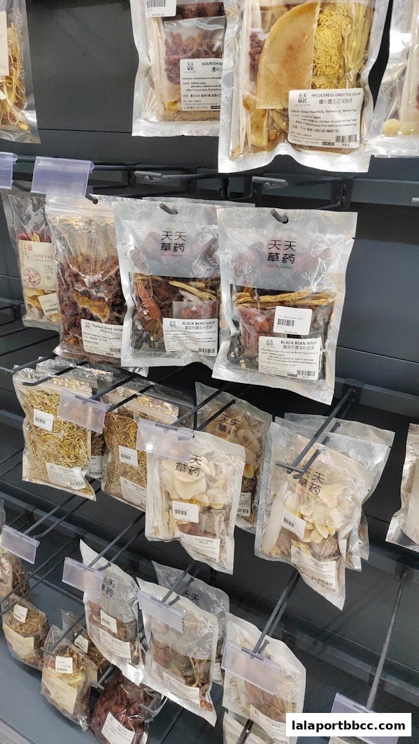 A display of pre-packaged herbal soup ingredients and dried goods on shelves.