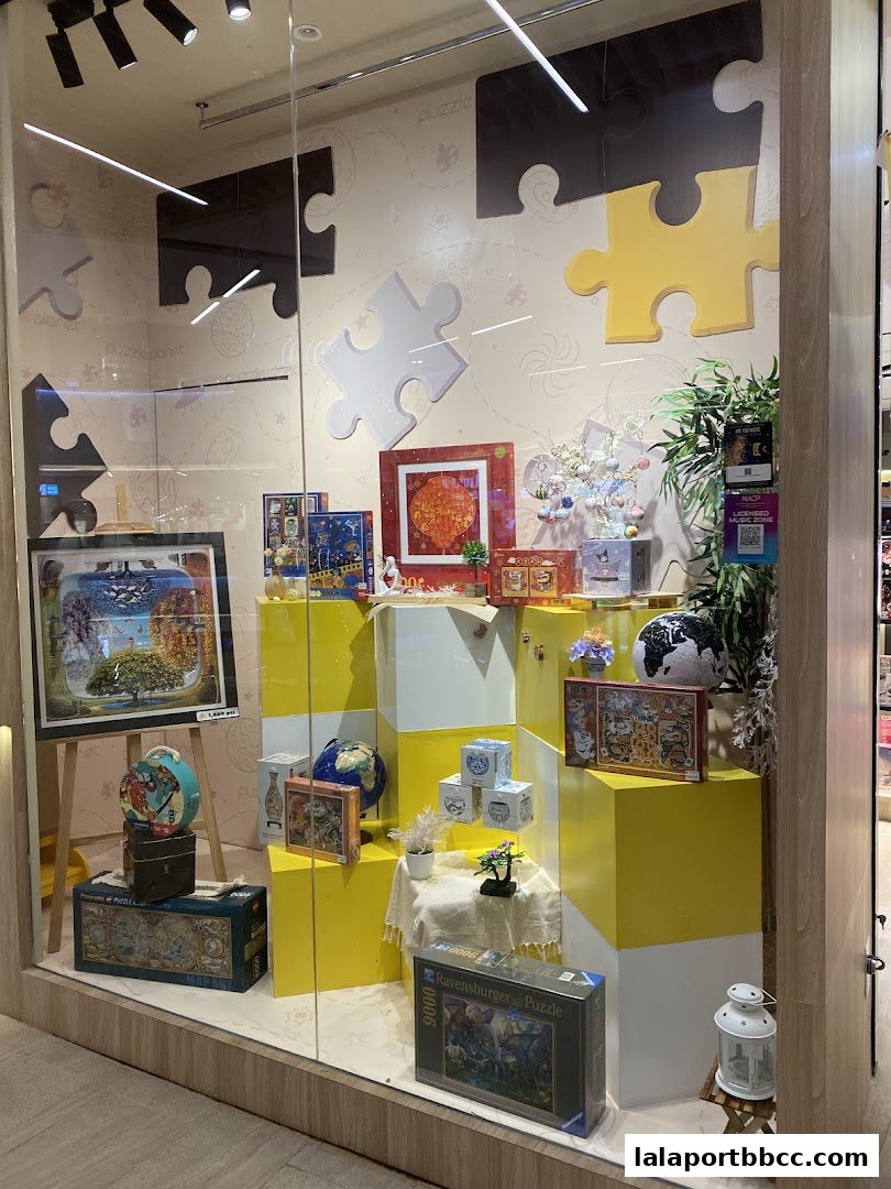 A shop window display featuring various puzzles and puzzle-themed decorations.