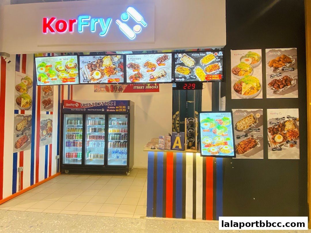The KorFry shop front displays a vibrant menu with various Korean fried chicken and street snack options.