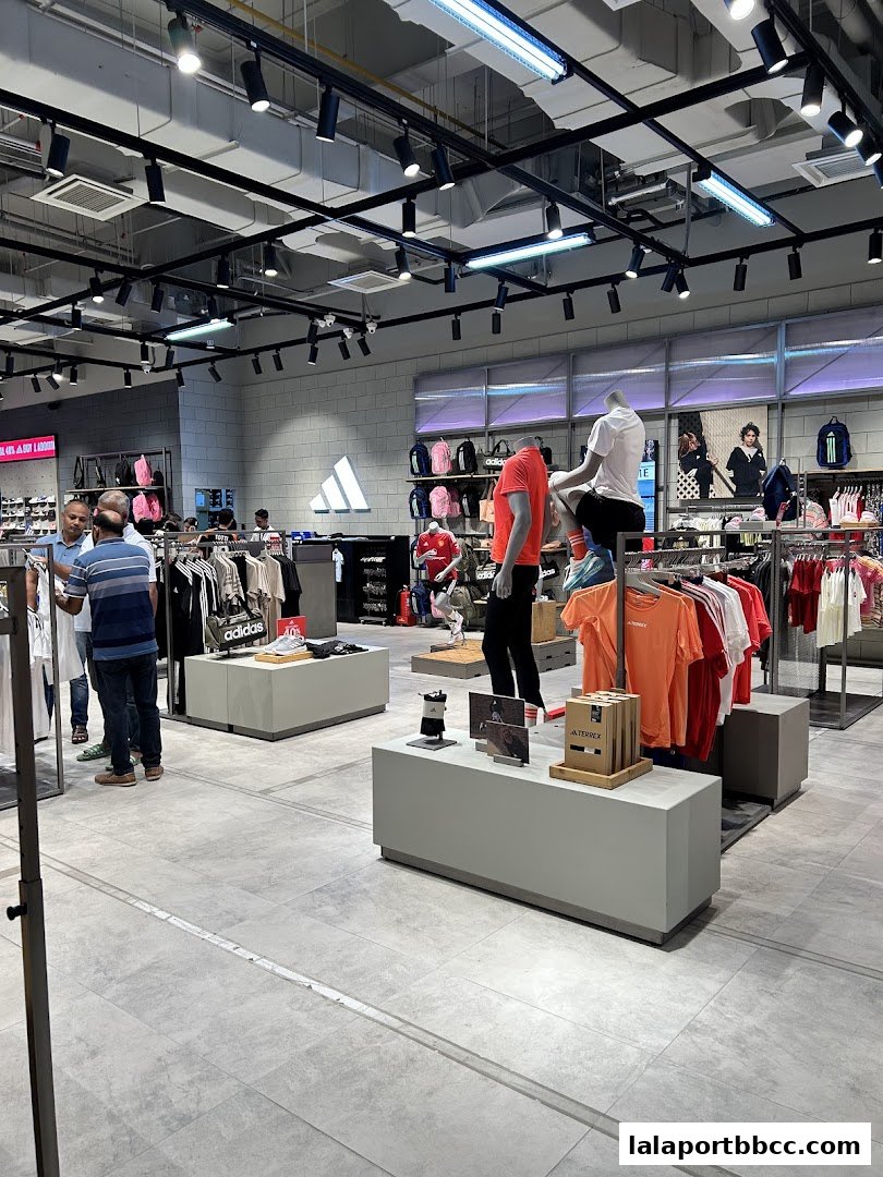 Interior view of an Adidas Originals store showcasing apparel and footwear with mannequins.
