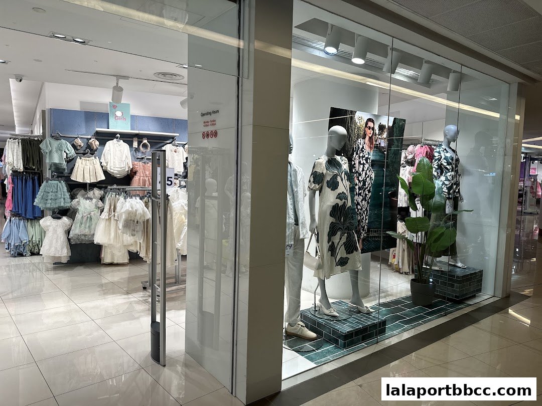 Max Fashion store entrance showcasing children's clothing and mannequins in the window display.