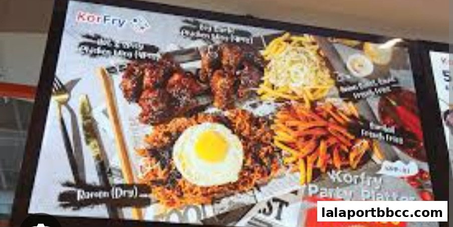 A display of KorFry's Party Platter featuring fried chicken, rice, egg, and fries.