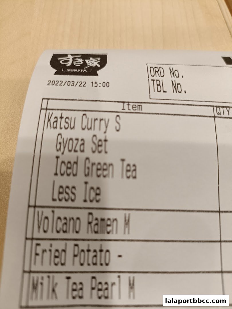 A receipt from Sukiya showing various Japanese food and drink items ordered.