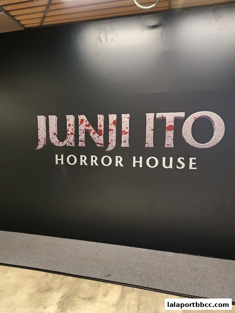 The Junji Ito Horror House logo is displayed on a black wall with a blood-splatter effect.