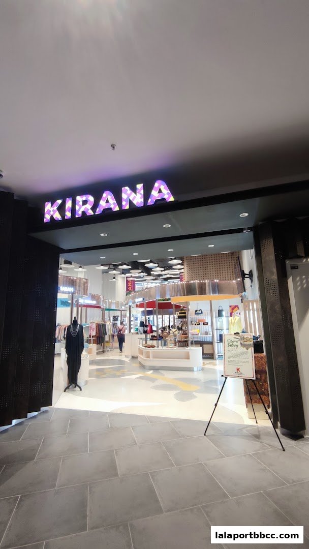The entrance to Kirana, a shop featuring clothing and accessories, with a mannequin and display stands visible.