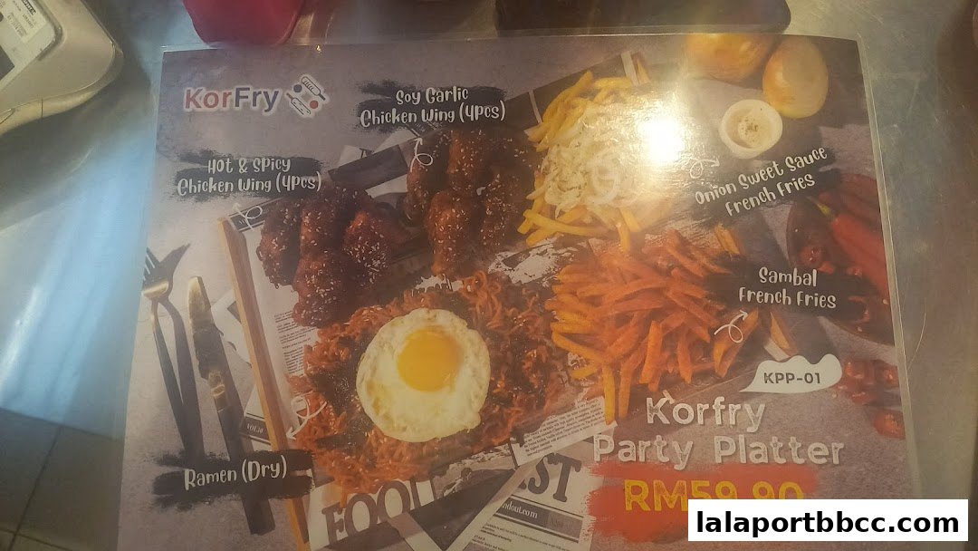 A menu featuring KorFry's party platter with chicken wings, ramen, and fries.