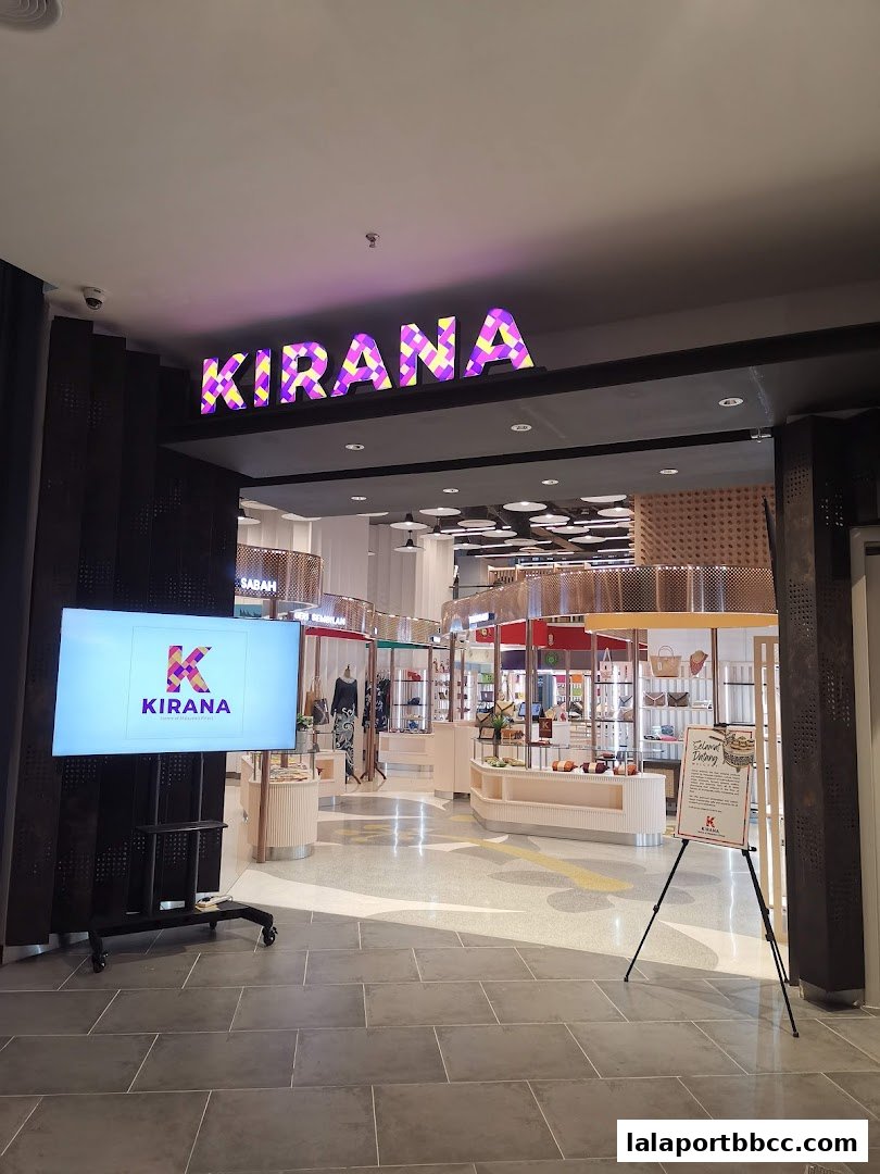 The entrance to Kirana by UDA Home of Malaysias Finest, showcasing its modern interior and branding.