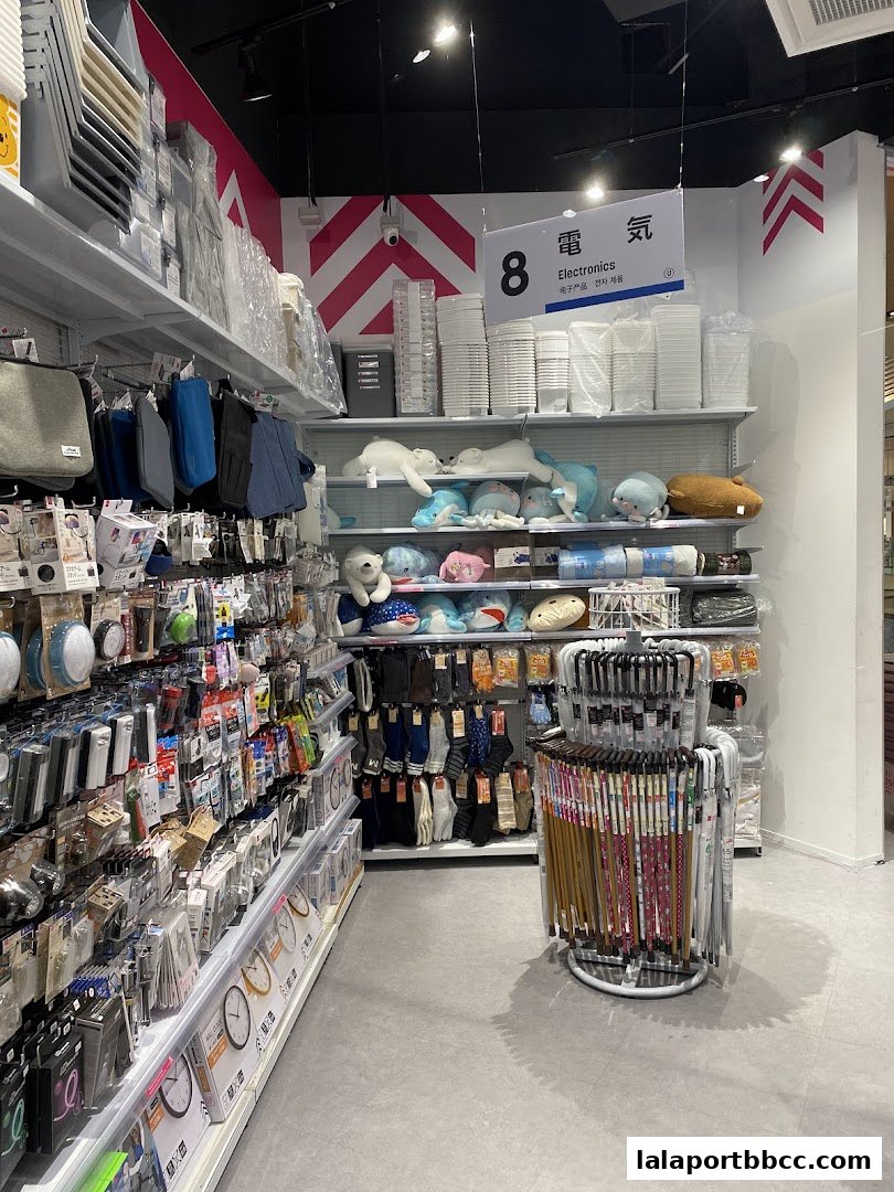 Interior view of a Daiso store showcasing various products on shelves and racks.