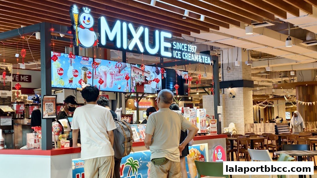 A MIXUE Ice Cream & Tea shop with customers ordering at the counter.
