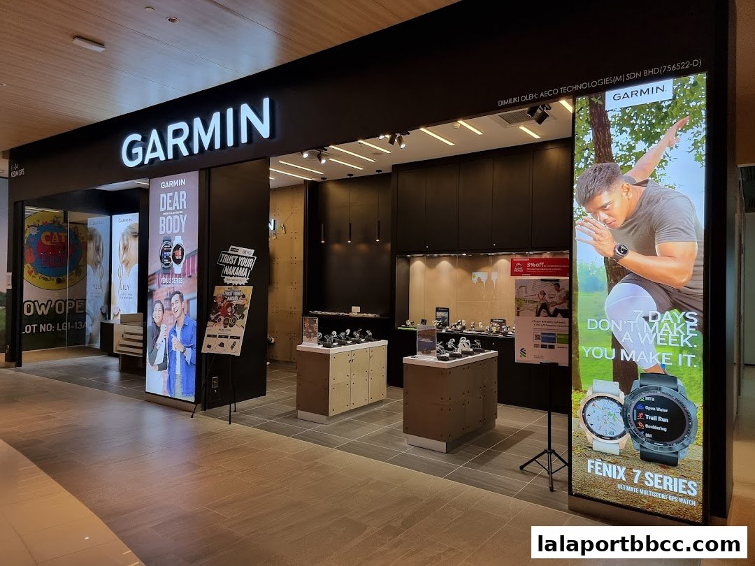 The exterior of a Garmin store showcasing various smartwatches and promotional displays.