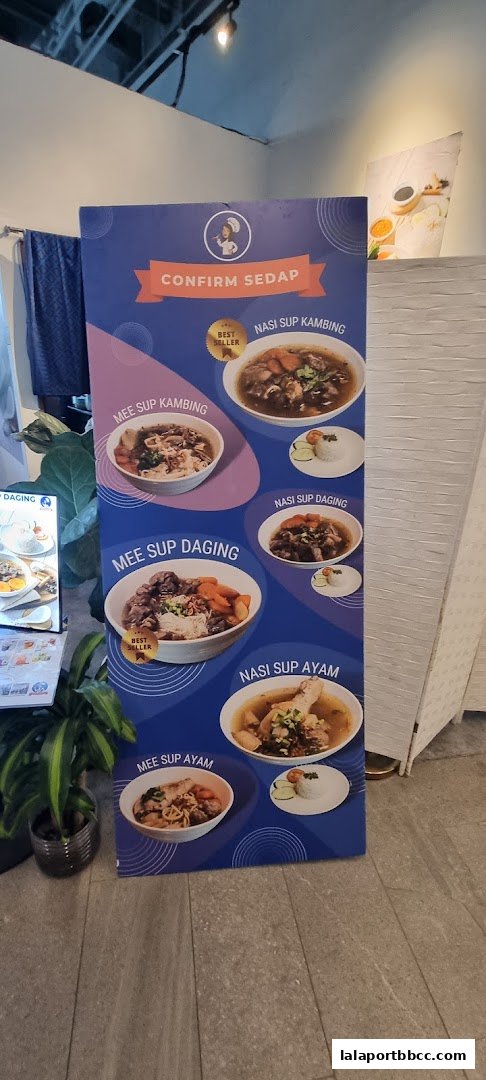A display board showcasing various soup dishes offered by Confirm Sedap.