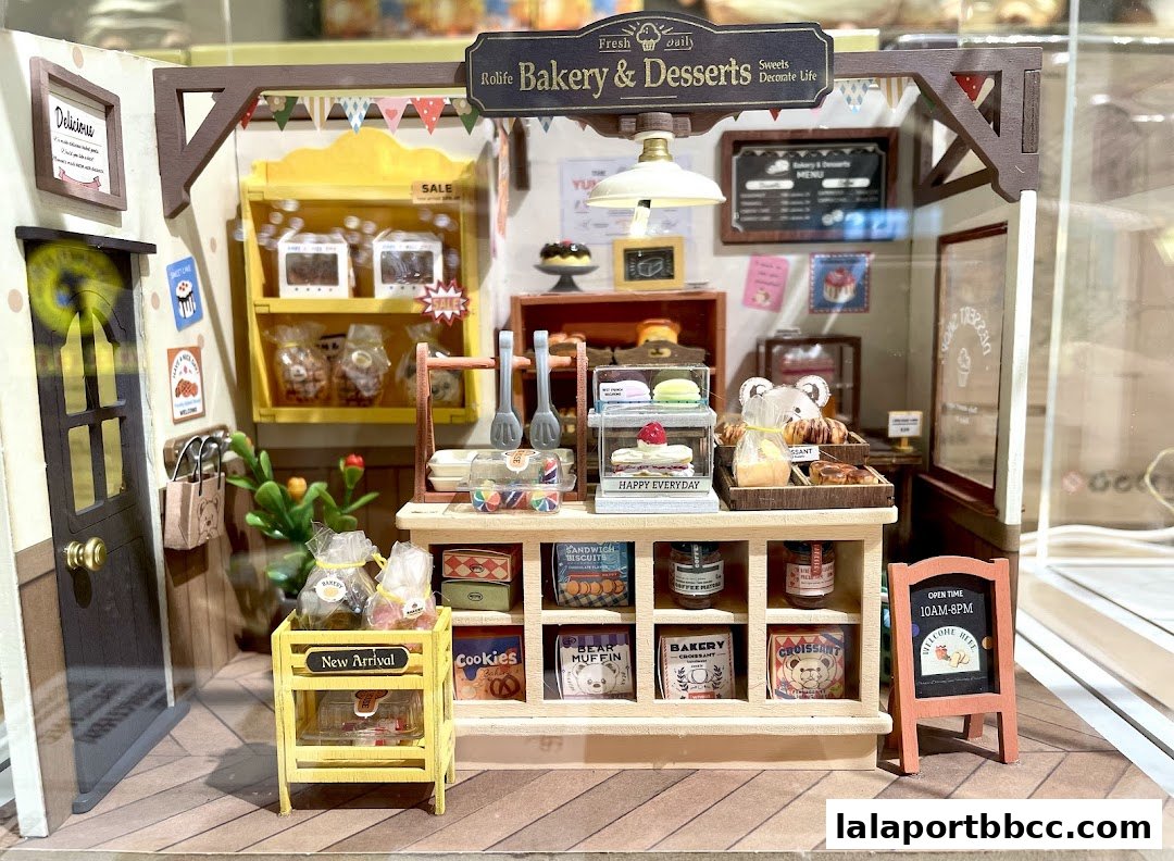 A miniature bakery and dessert shop display with various baked goods and treats.