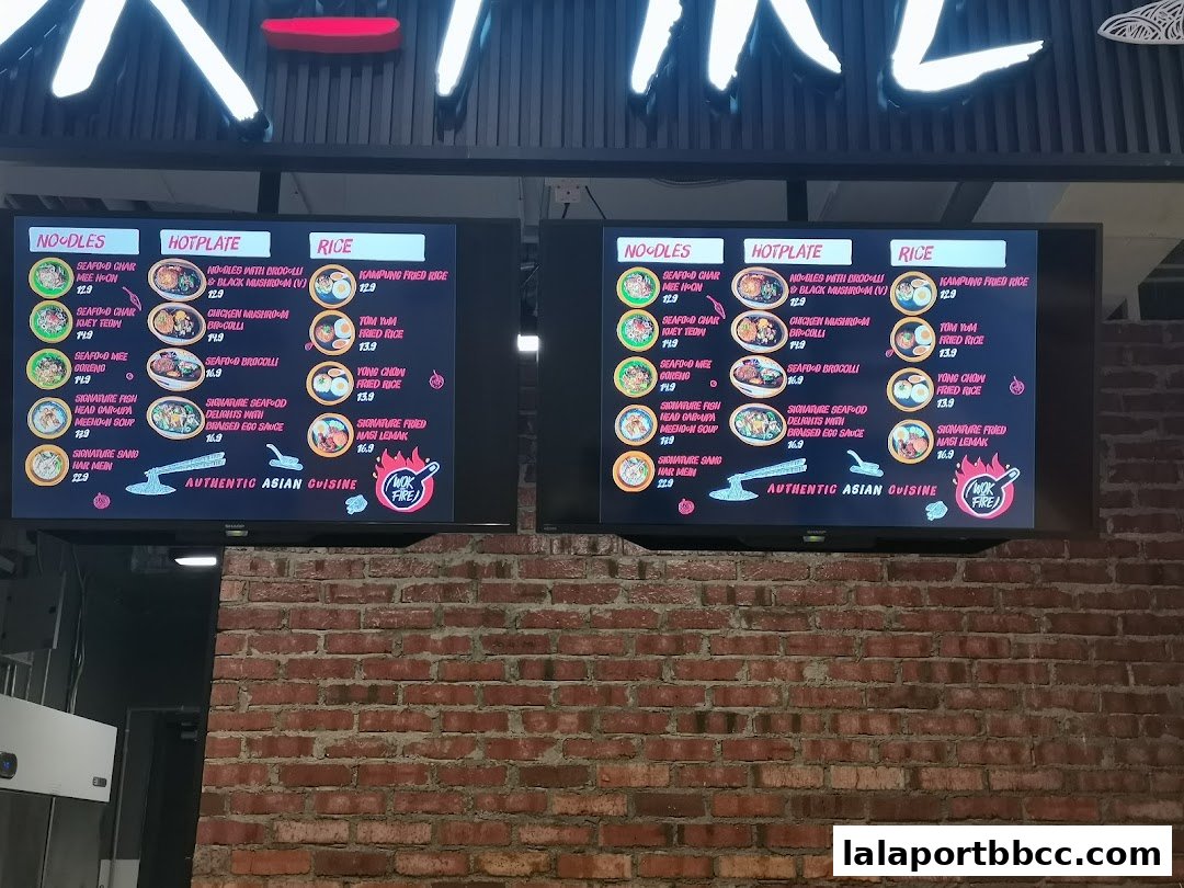 Digital menu boards displaying authentic Asian cuisine with categories for noodles, hotplate, and rice dishes.