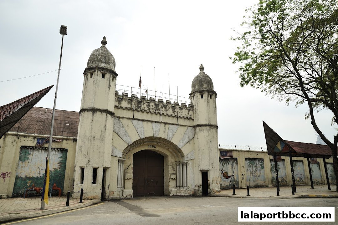 The imposing north entrance of Gate Plaza, featuring a historic architectural design with towers and a large arched doorway.