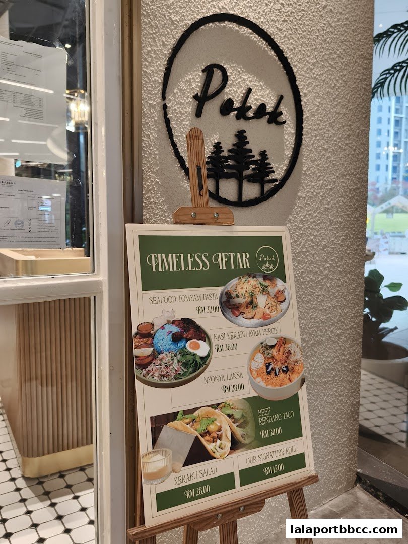 A menu board displaying various dishes with prices outside a shop.