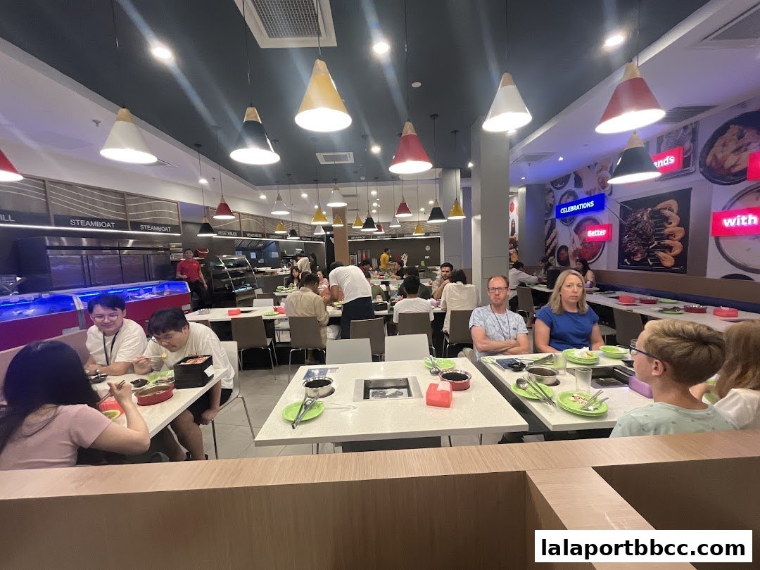 Diners enjoy a meal at Seoul Garden, a steamboat and grill restaurant with modern decor.