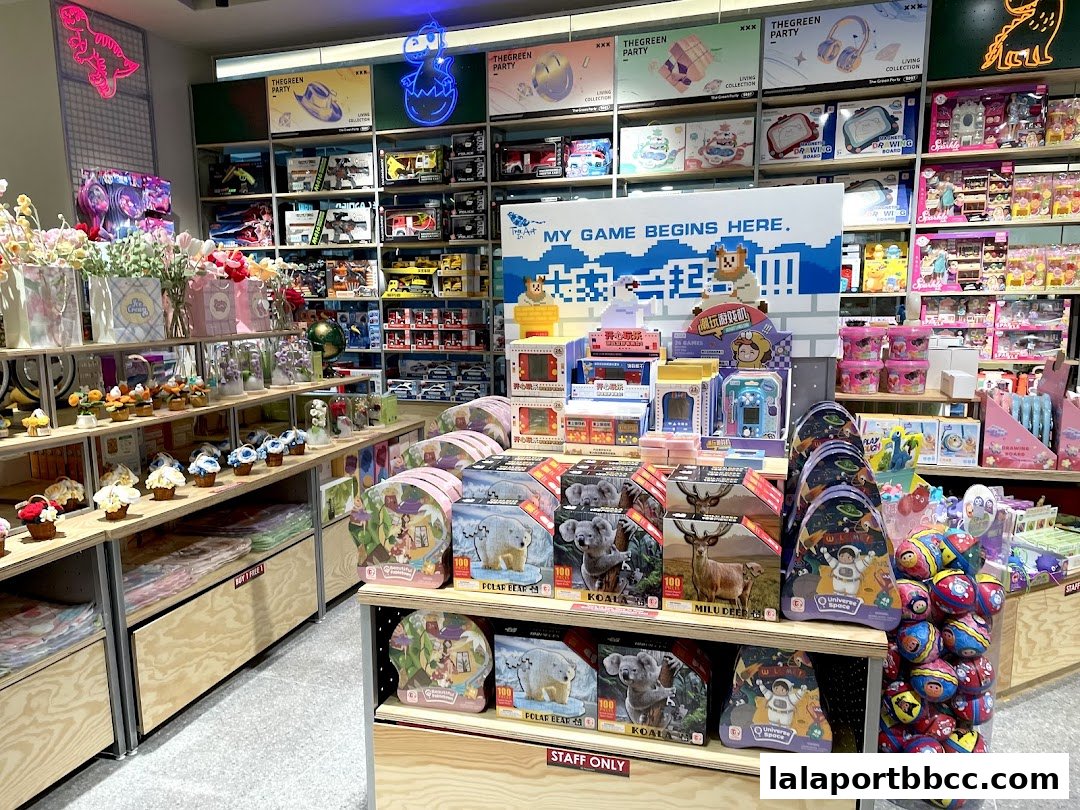 A brightly lit retail store interior filled with toys, games, and decorative items, showcasing a vibrant display.